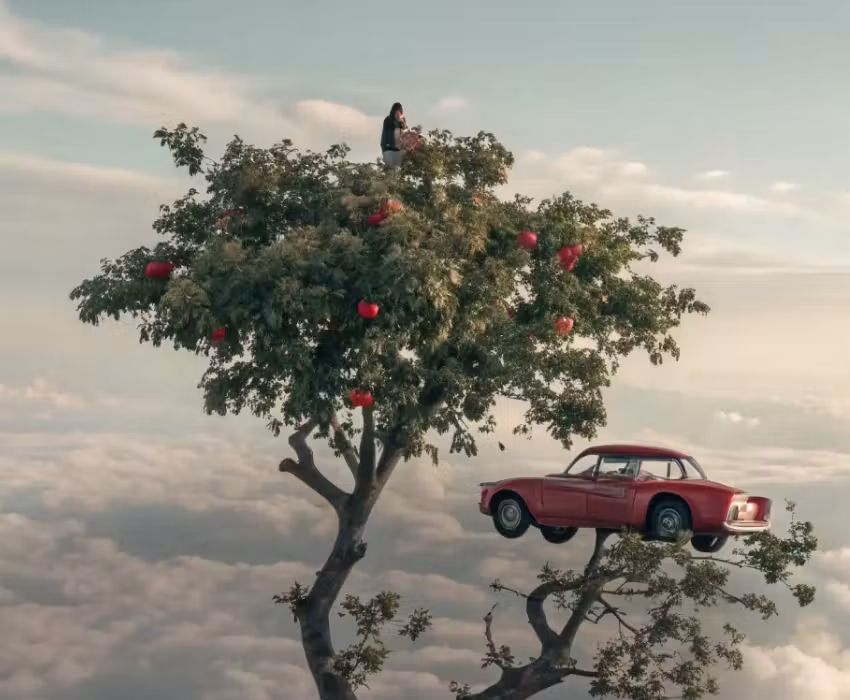 Kling 4 Beispiel: Ein kleines rotes Auto steht neben einem Baum auf einer schwebenden Felseninsel