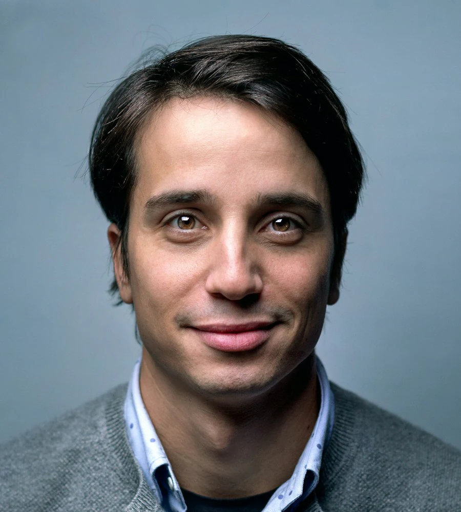 Creative illustration: A man's portrait against a pale blue background
